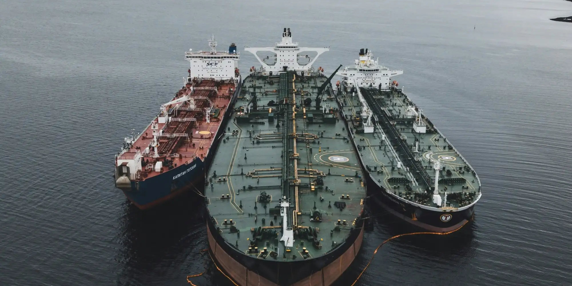 Bulk tankers moored side by side at an industrial terminal